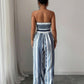 👗 50% OFF NOW! 💥 Geometric Jumpsuit with Halter Neckline & Side Slit – Unique print & elastic back – Versatile, perfect for summer parties or resort wear ✨
