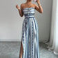 👗 50% OFF NOW! 💥 Geometric Jumpsuit with Halter Neckline & Side Slit – Unique print & elastic back – Versatile, perfect for summer parties or resort wear ✨