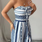👗 50% OFF NOW! 💥 Geometric Jumpsuit with Halter Neckline & Side Slit – Unique print & elastic back – Versatile, perfect for summer parties or resort wear ✨